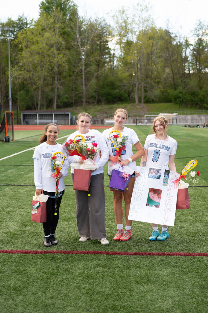 Pictured: Varsity girls lacrosse player and their family