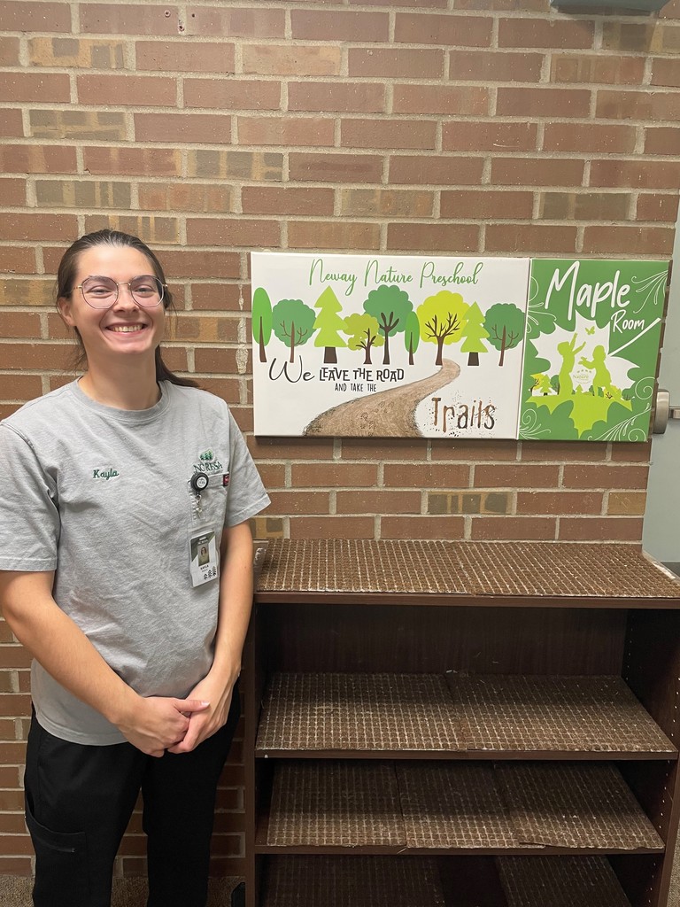 Kayla standing next to Neway Nature sign