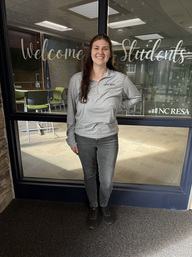 Gem standing in front of windows at the Career-Tech Center.