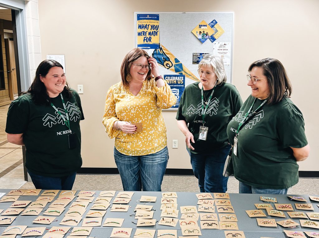 staff laughing and looking at jewelry