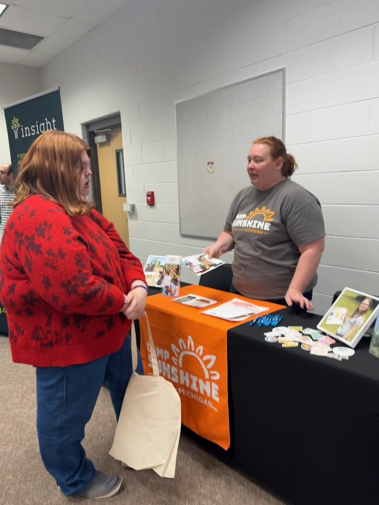 Transition Fair student talking to Camp Sunshine staff