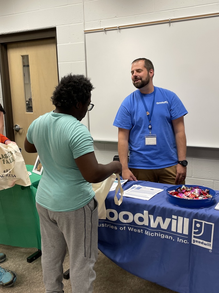 Transition Fair  student talking to Goodwill staff