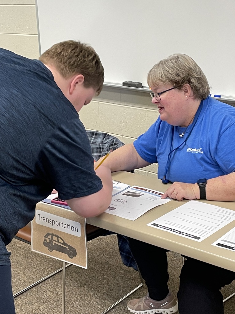 Reality Fair student filling out a transportation form