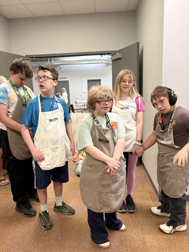 aprons on and ready to make dog biscuits 