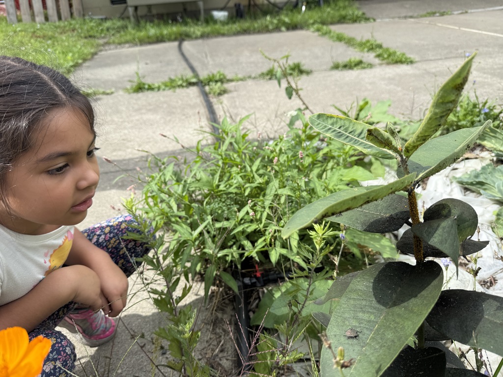 student up close with flowers
