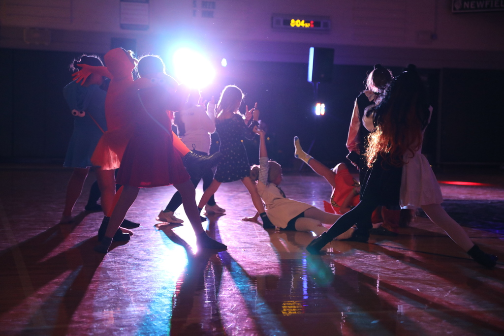 students striking a pose on the dancefloor 