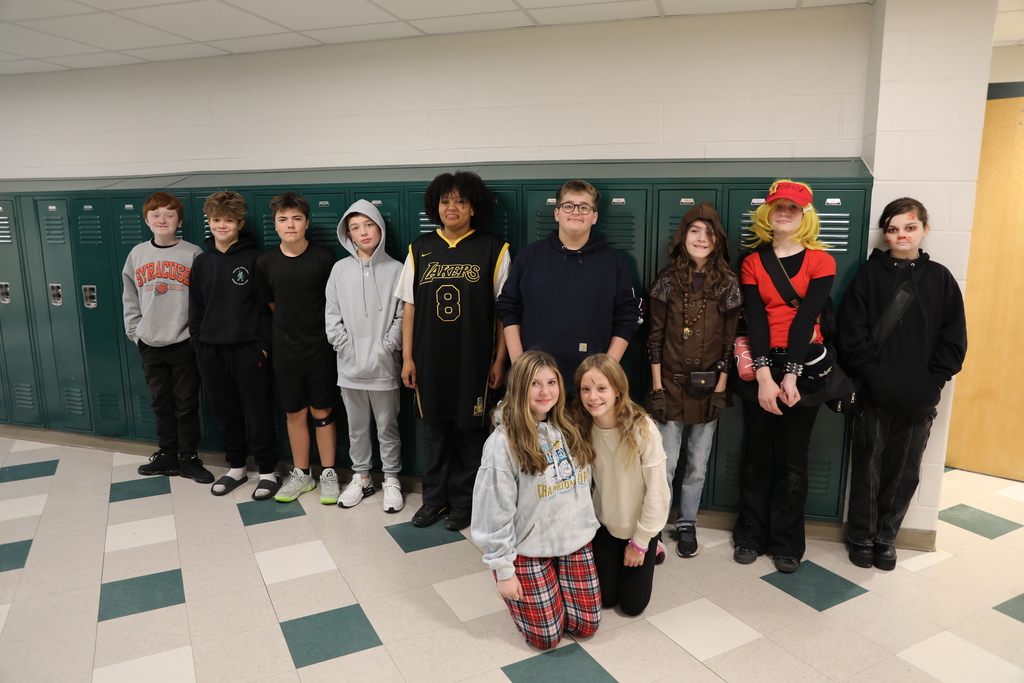 A class photo for Halloween, the entire class standing in the hallways posing for a picture