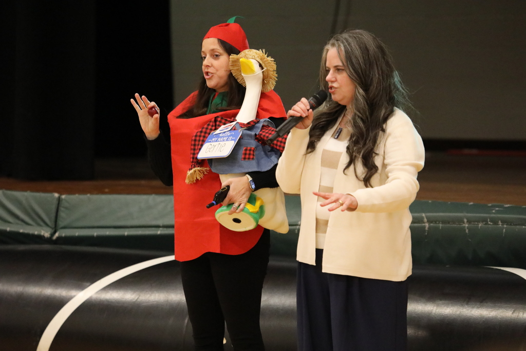 Two adults speaking to the group