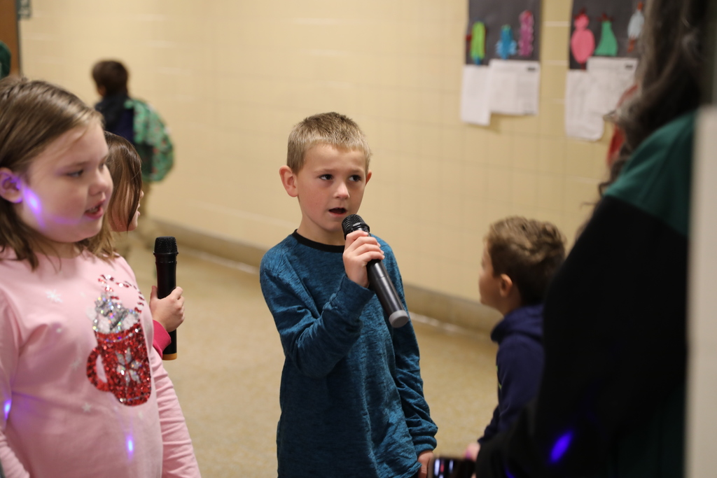 A student singing into the microphone
