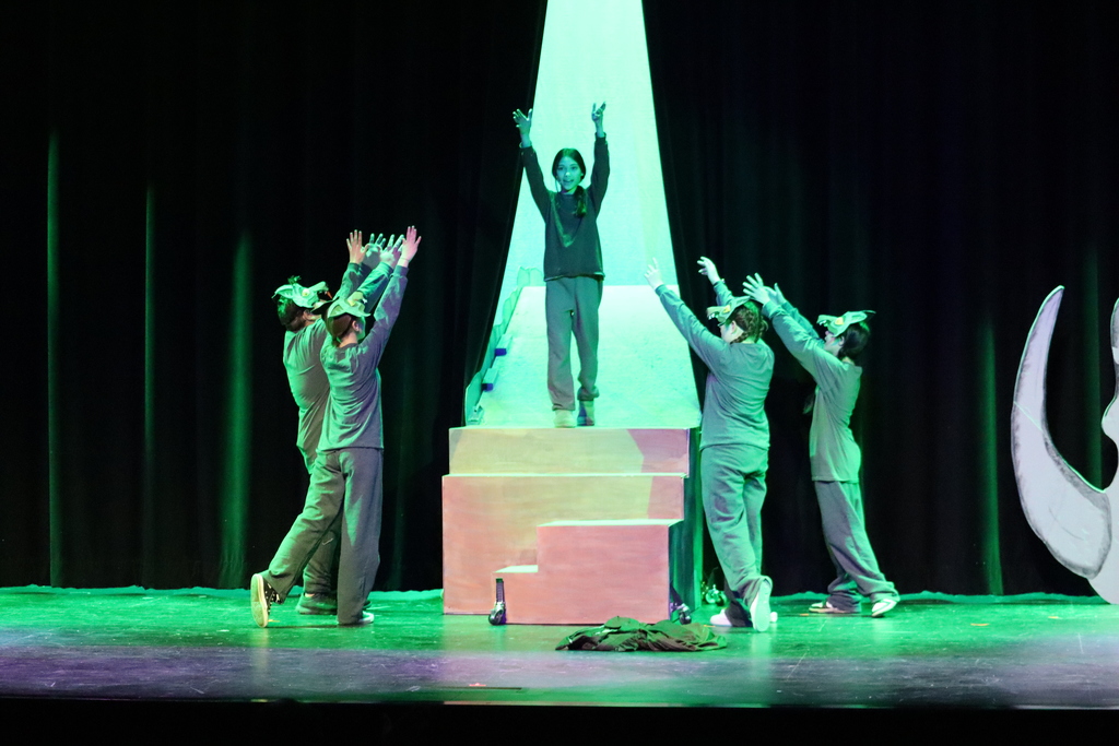 5 students acting out a scene