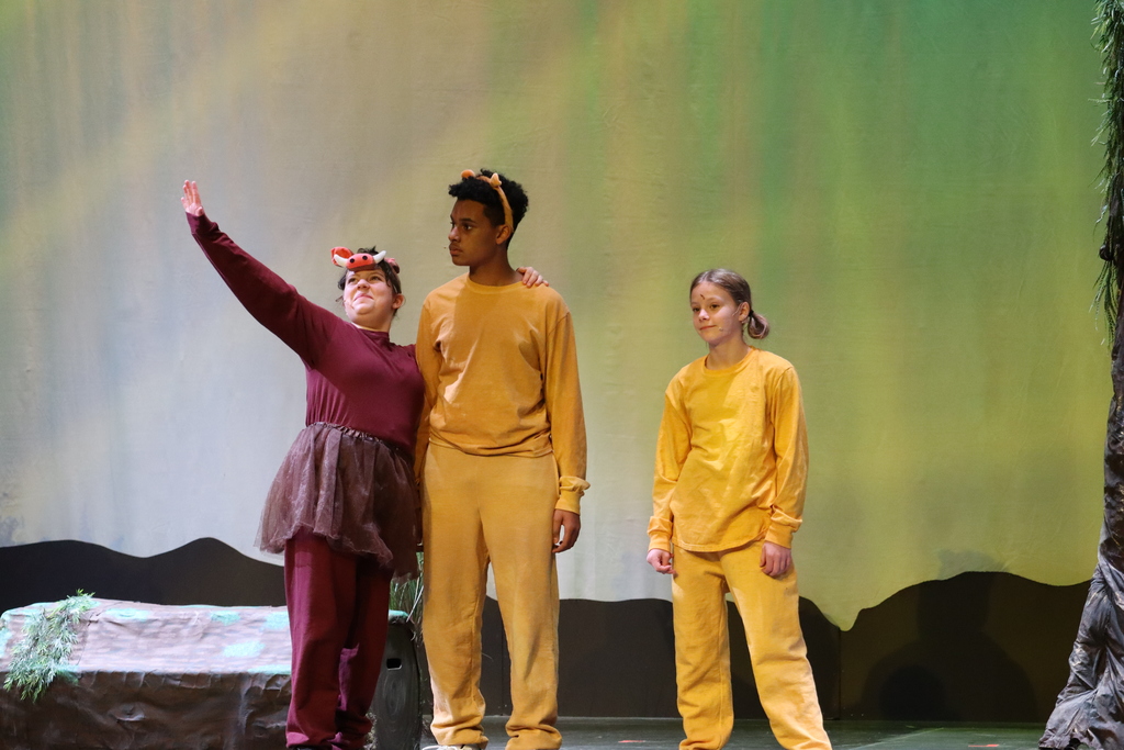 3 students acting out a scene