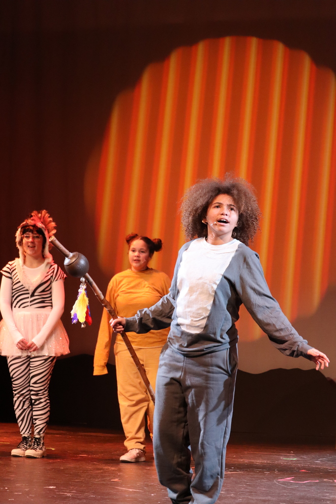 3 students acting out a scene