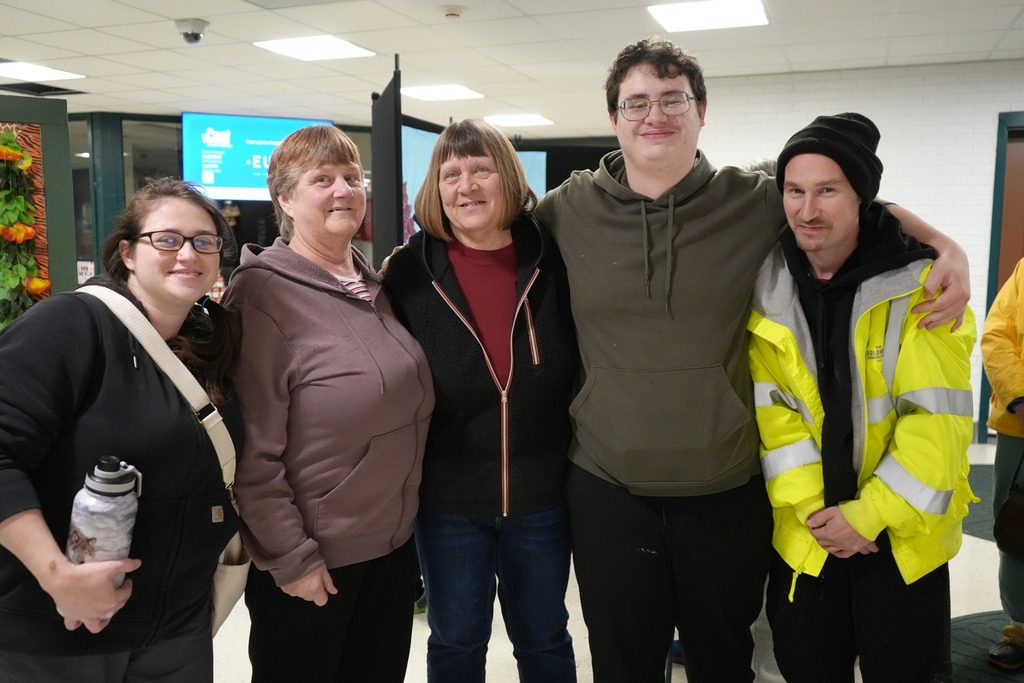 family waiting together at the 2nd annual harvest dinner