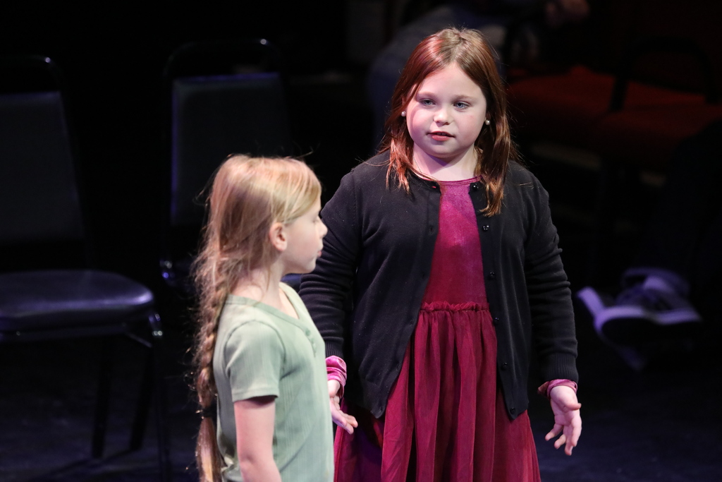 Two students acting out a scene in their play