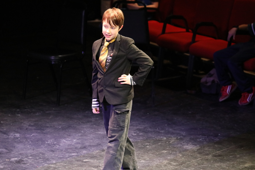 One student performing their role in the play