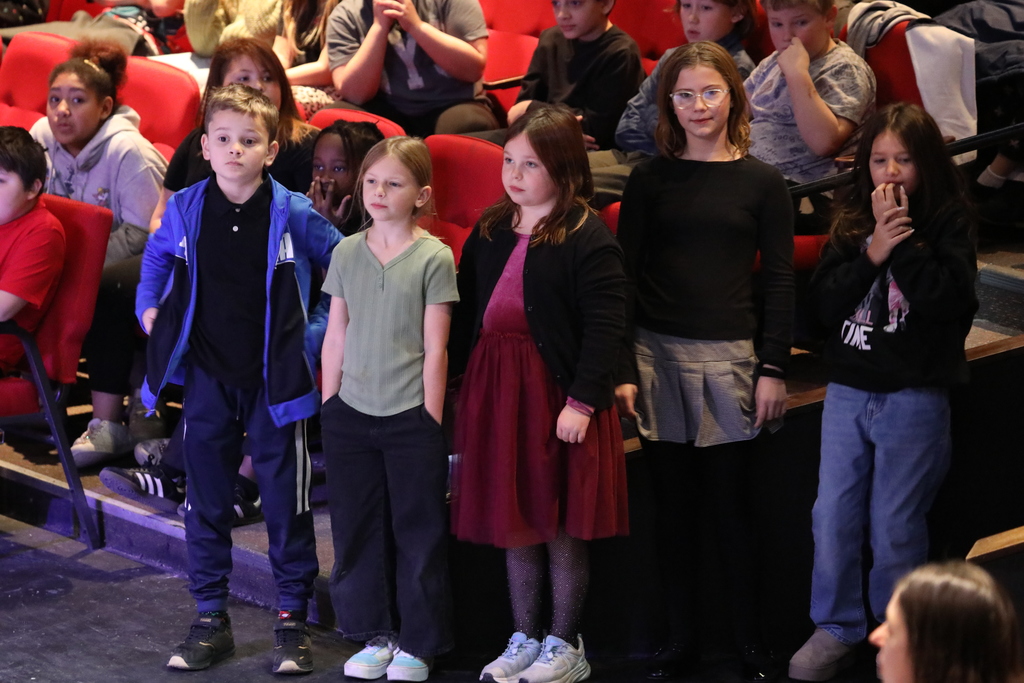 A few students stand by and watch the performances
