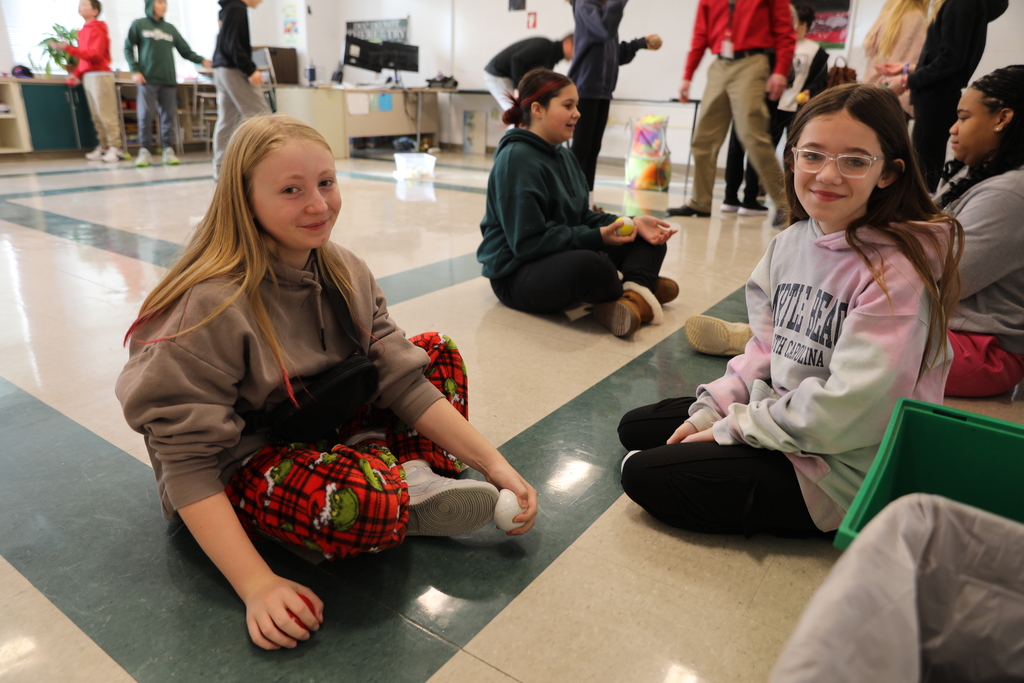 two students smiling for the camera