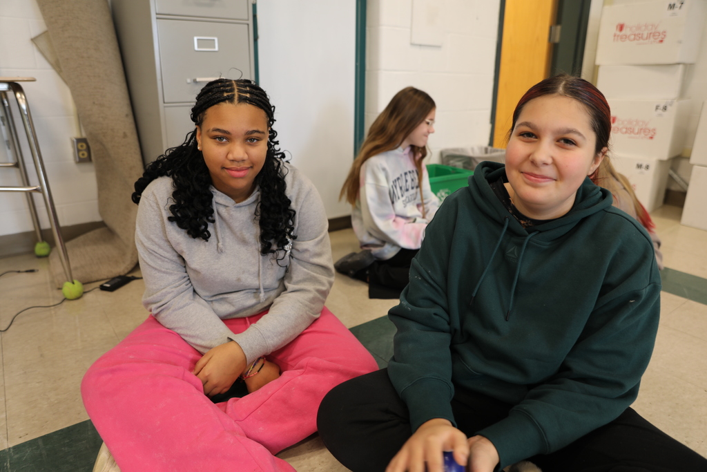 two students smiling for the camera