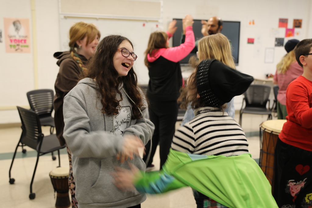 two students laughing at playing the clapping game