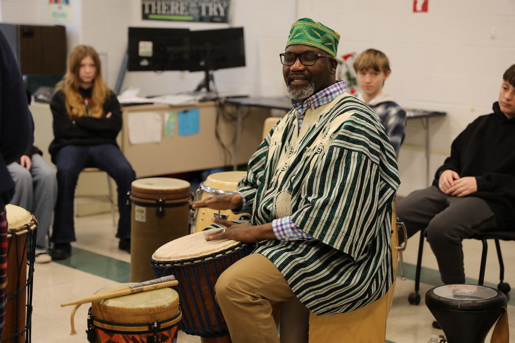 Aloja playing a drum