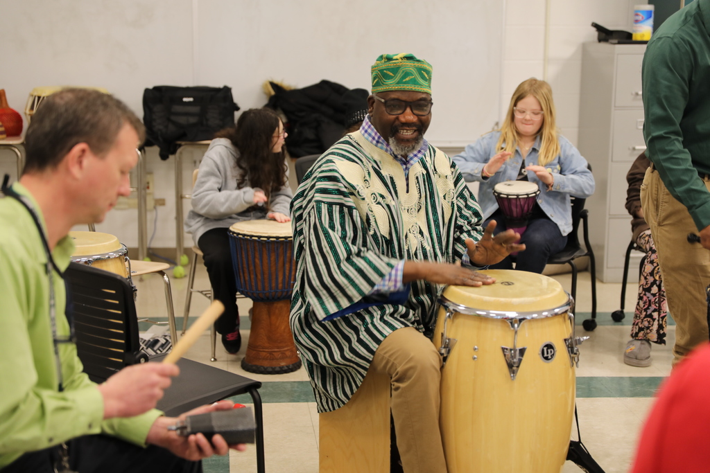 Aloja drumming on a big drum