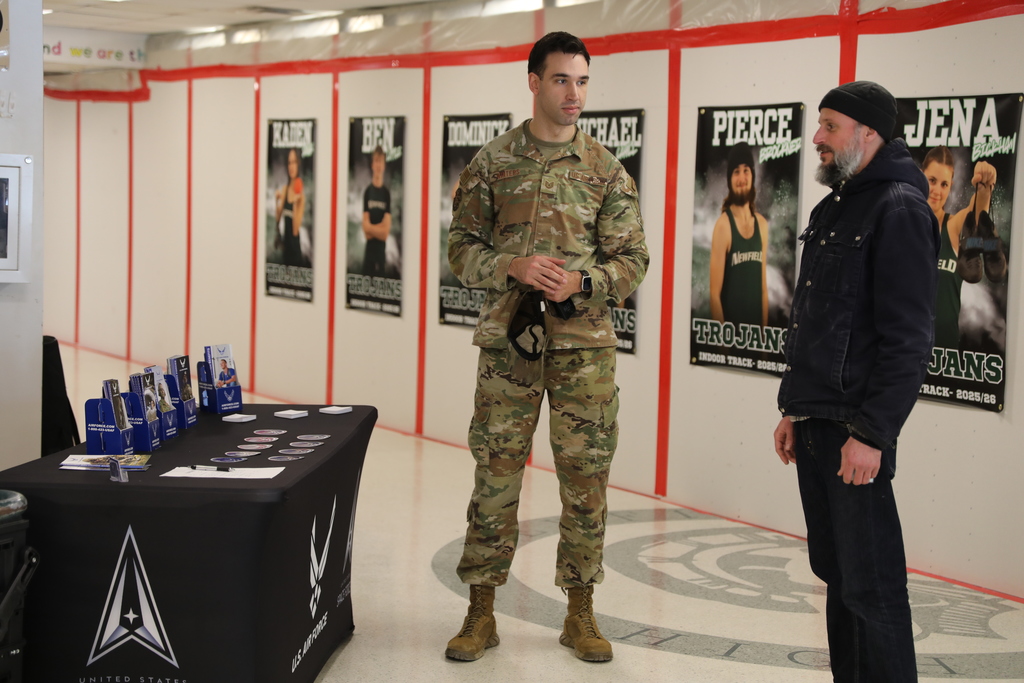 An Airforce recruiter speaking with a staff member