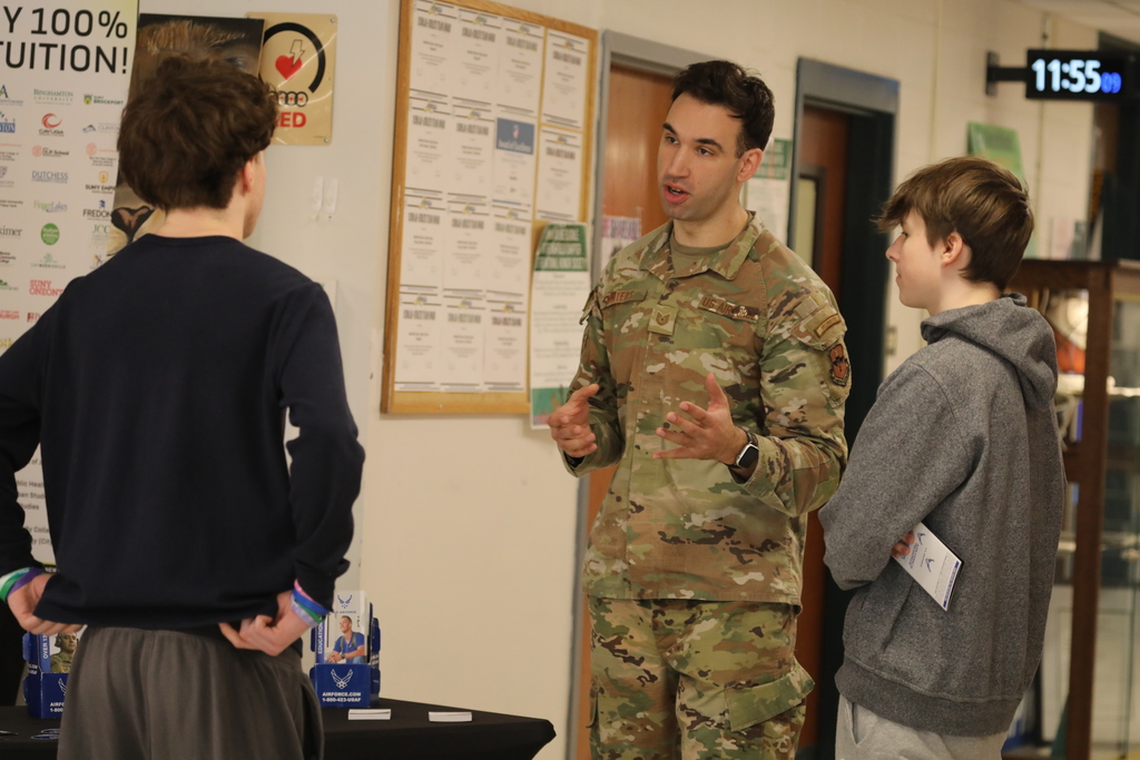An Airforce recruiter speaking with students