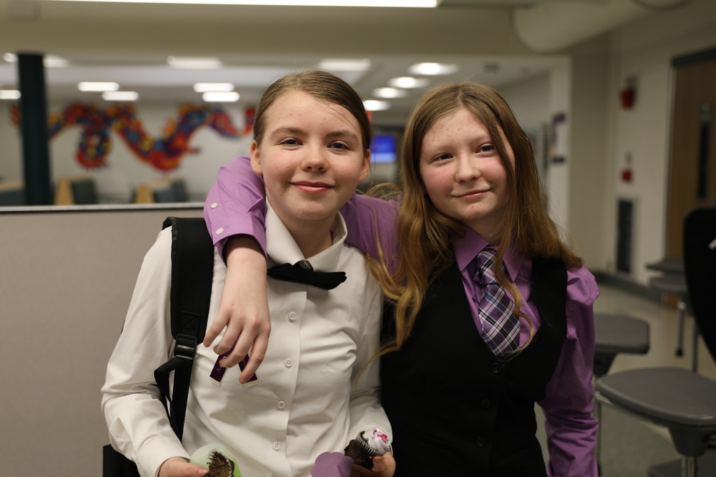 two students who were in the performance posing for a photo after