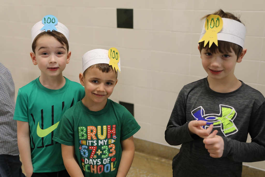 3 students posing for a photo with their 100 day hats on