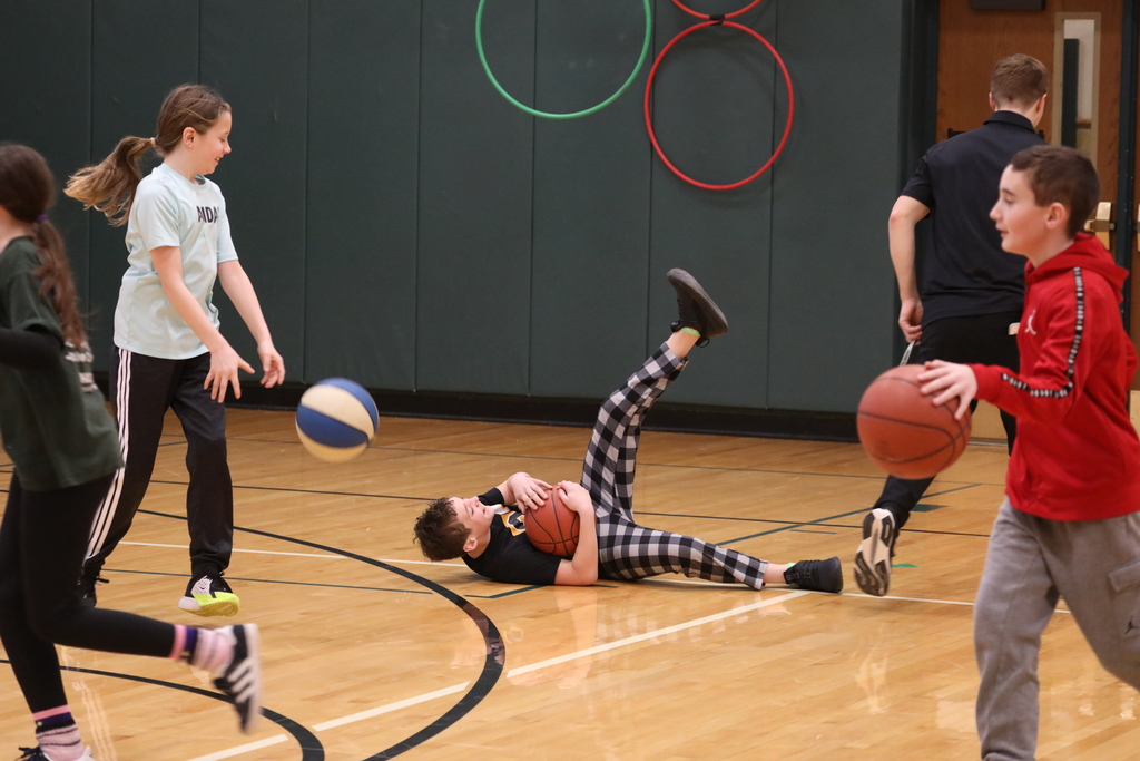 a student goofing around during the 100 dribble challenge 