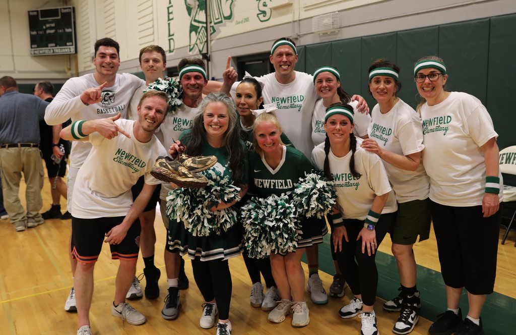 the elementary school team posing together after winning