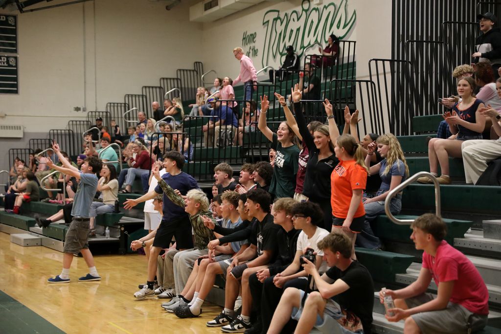 the students, families, and audience cheering 