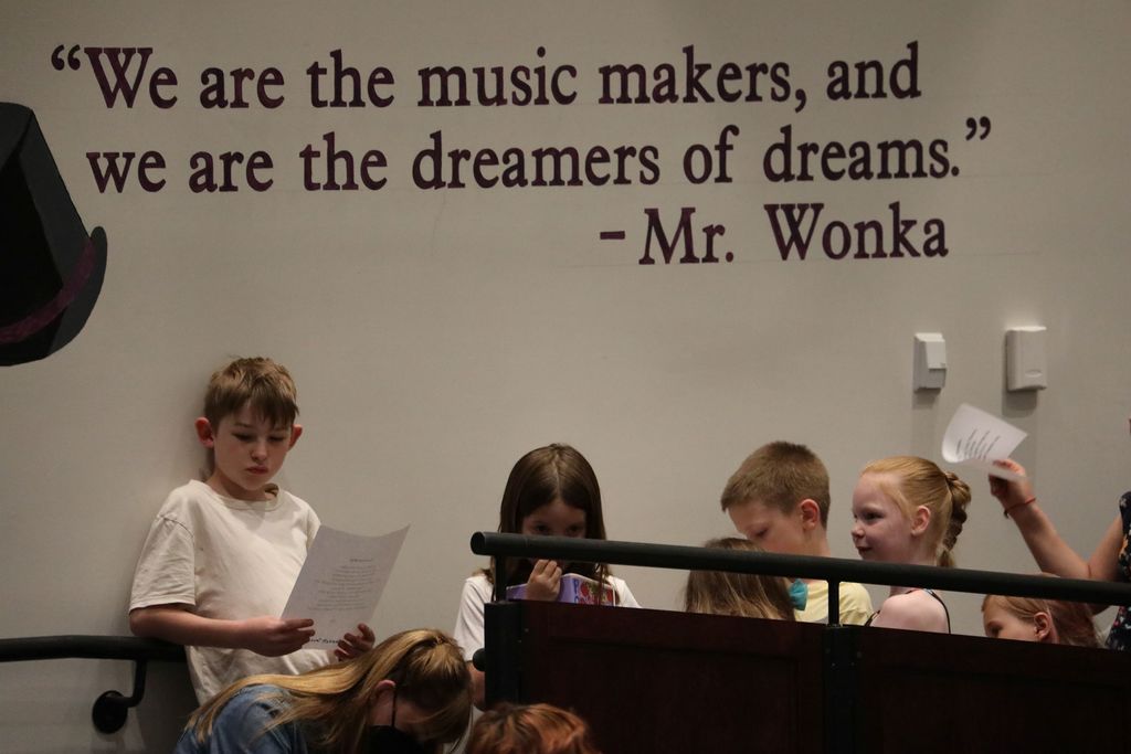 A line of students waiting for their turn to read their poems