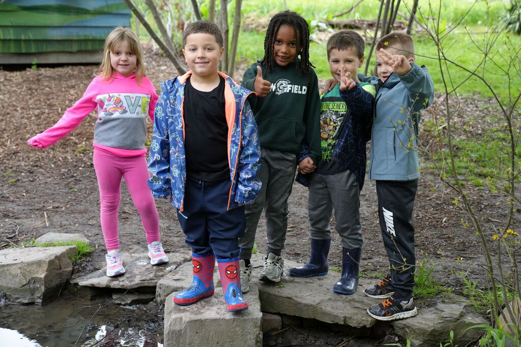 five students smiling for the camera