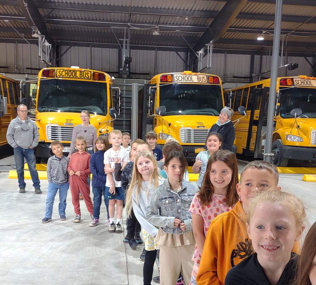students all lined up infront of the busses