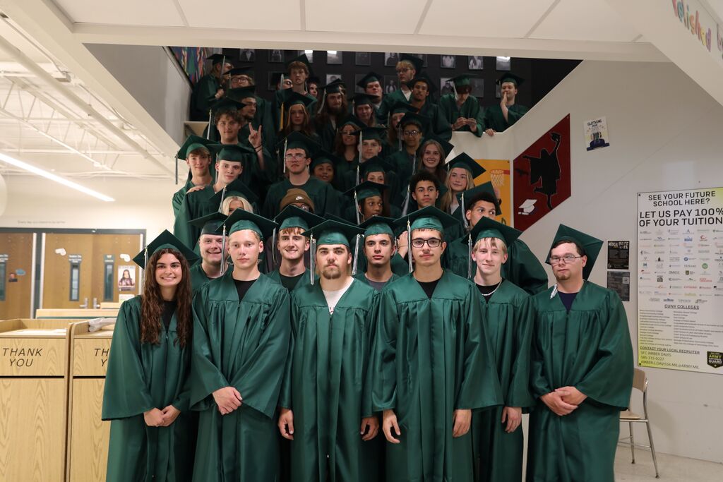 a group photo on the high school stairs