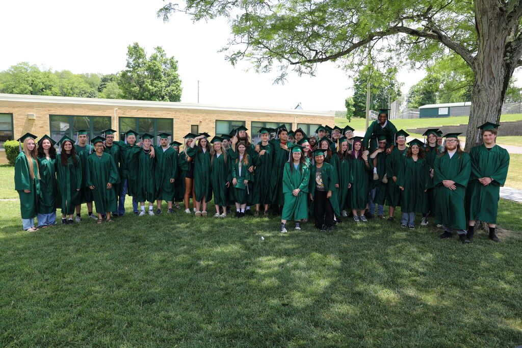 a group photo of the class outside