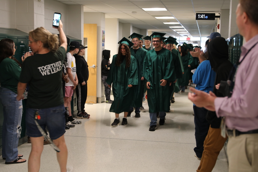 seniors walking down the middle school hallway