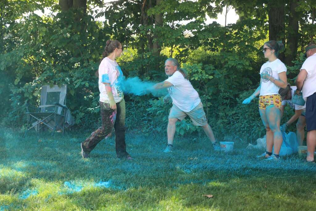 someone getting a bunch of blue color thrown at them
