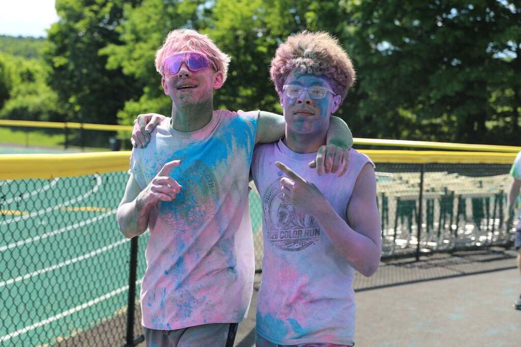 two students posing for the camera after the color run