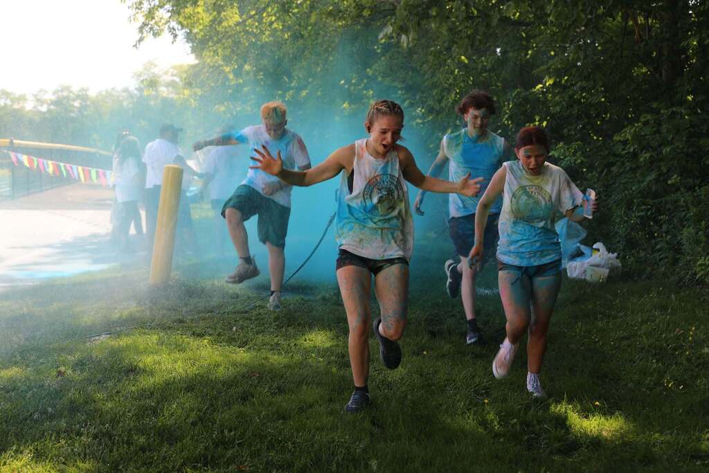 some students getting more color thrown at them as they run
