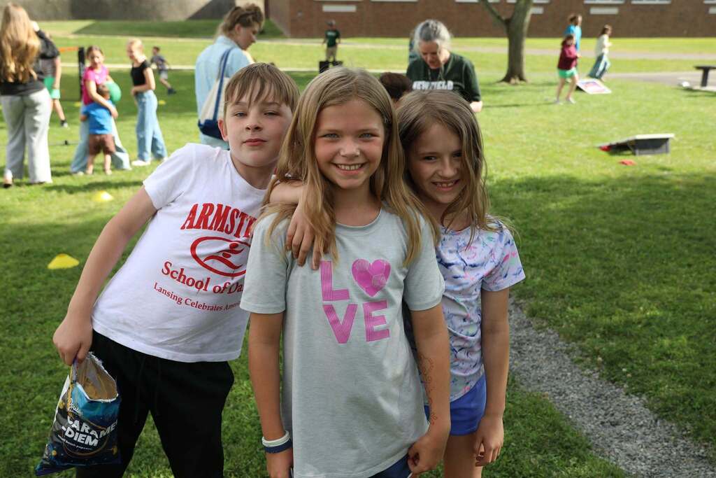 three students posing for the camera