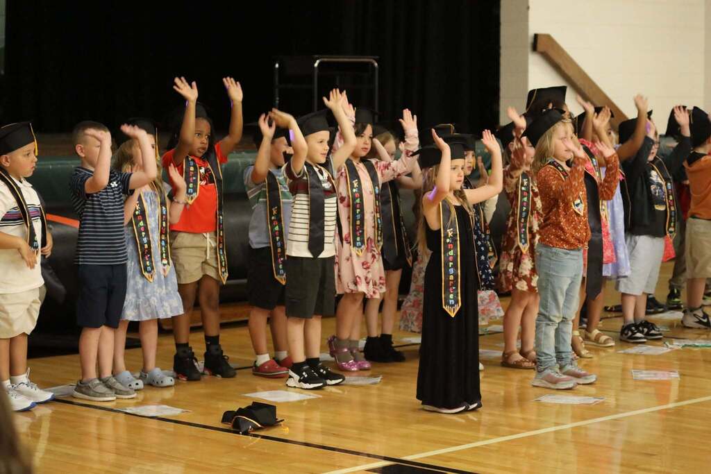 a group of students singing a song