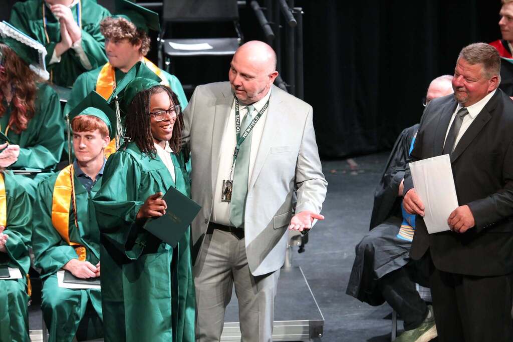 a student receiving their diploma