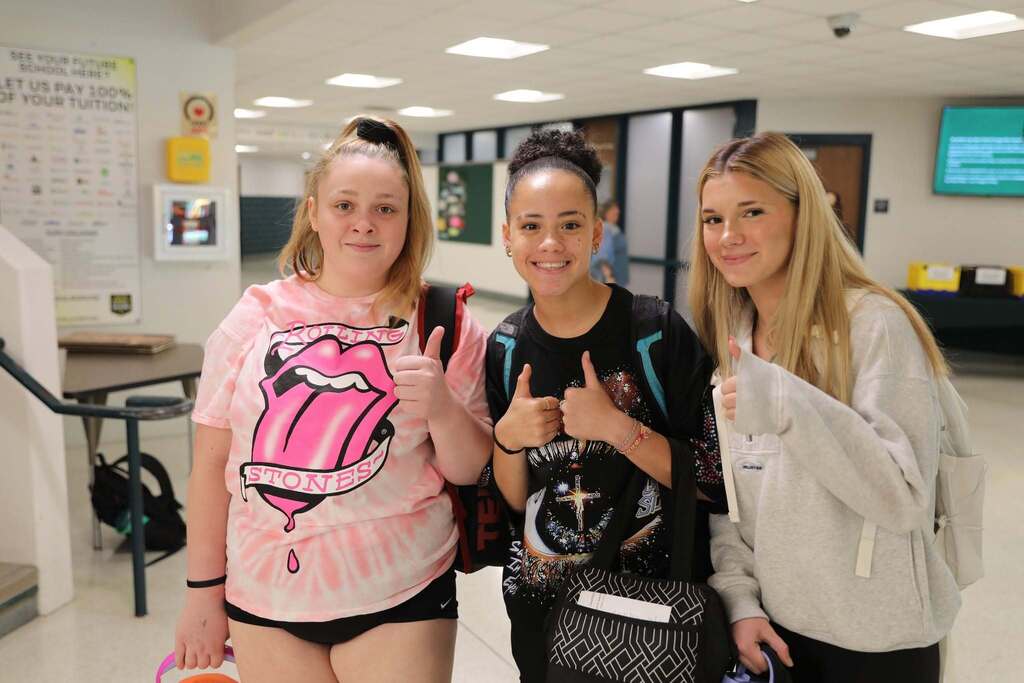 three students posing for a photo