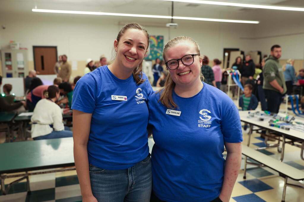 two sciencenter staff posing for the camera