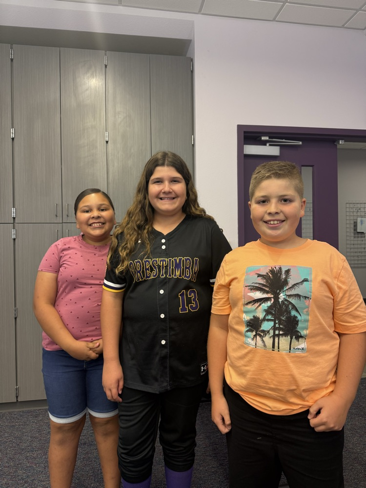 The students speaking at board meeting.