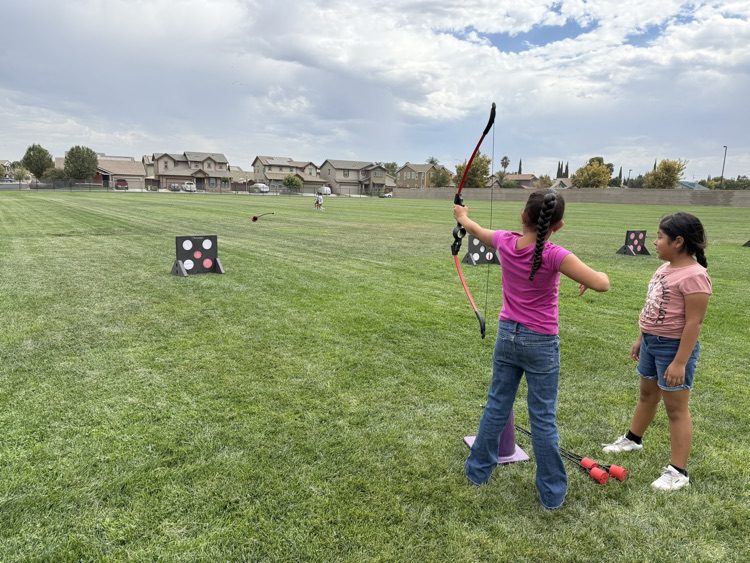 Fourth graders doing archery.