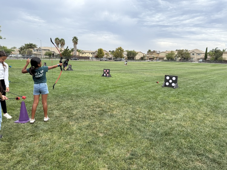 Fourth graders doing archery.