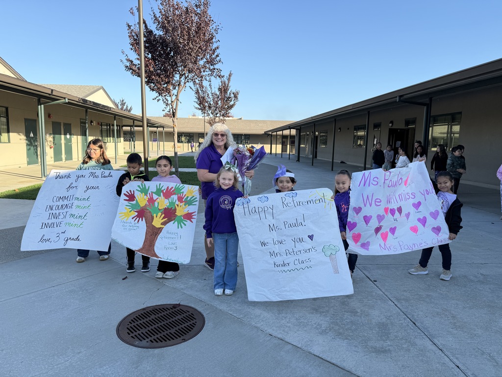 Teacher reciving gifts for retirement.
